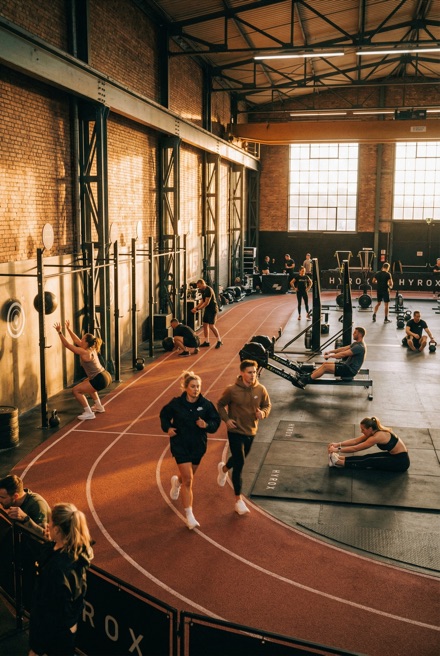 Athletes training in a large gym hall