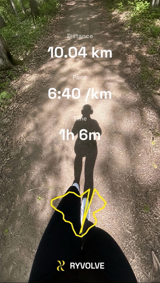 Trail run point-of-view with RYVOLVE 10.04 km run stats overlay
